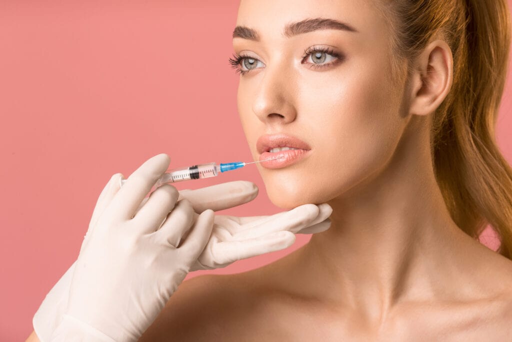 A woman recieving lipp filler in Birmingham